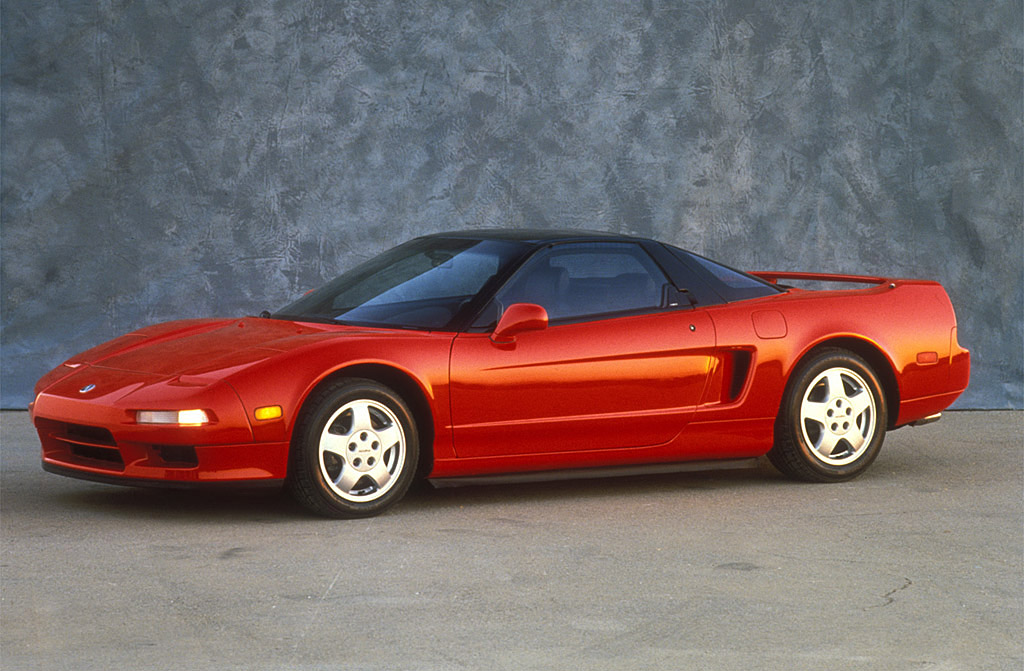 Original Acura NSX - A red Acura NSX parked in a picturesque setting, showcasing its timeless design and iconic status in automotive history.