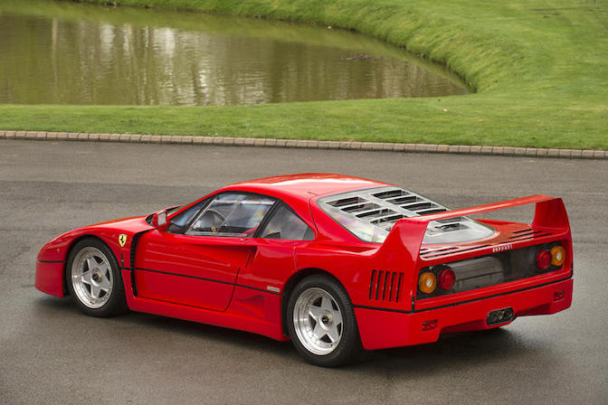 Image of a red Ferrari F40, a legendary supercar known for its striking design and exhilarating performance.