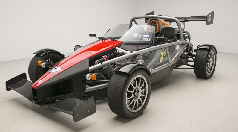 Ariel Atom - A high-performance lightweight sports car with a raw and aggressive design.