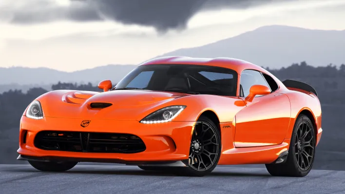 Sleek and powerful Dodge Viper showcasing its iconic design and roaring performance on the road.
