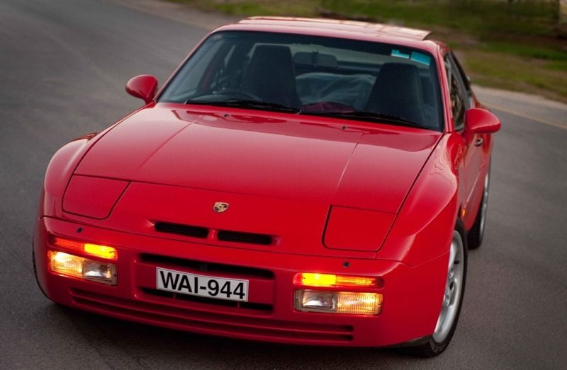 A vibrant red Porsche 944, showcasing its iconic design and sleek lines.