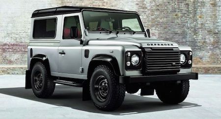 Land Rover Defender in a rugged wilderness setting, showcasing its off-road capability and iconic design.