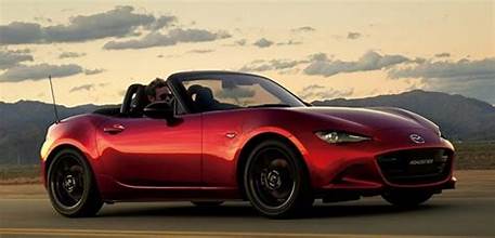 Image of the 2023 Mazda MX-5 roadster, showcasing its sleek design and open convertible top, symbolizing the joy of driving.